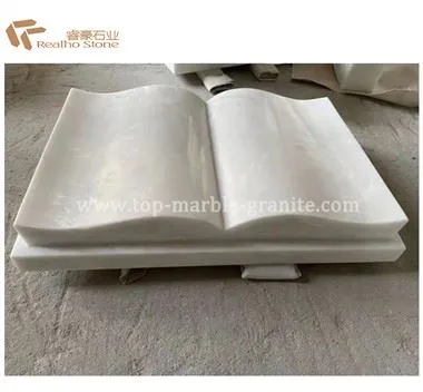 دست و کتاب یادبود مرمر سفید
